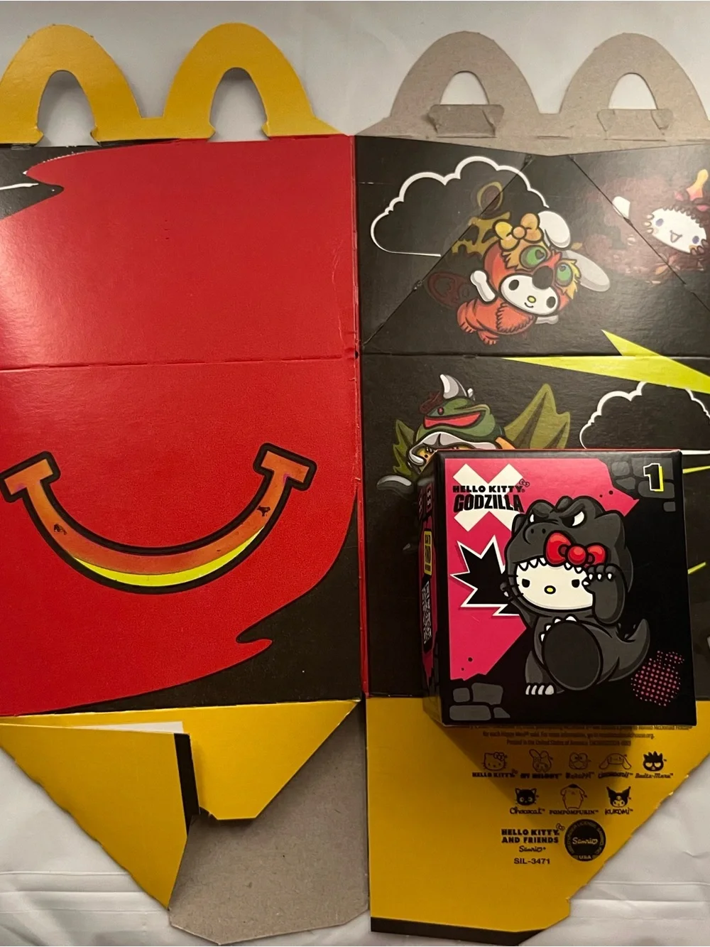 Hello Kitty Godzilla McDonald’s Happy Meal figure and box